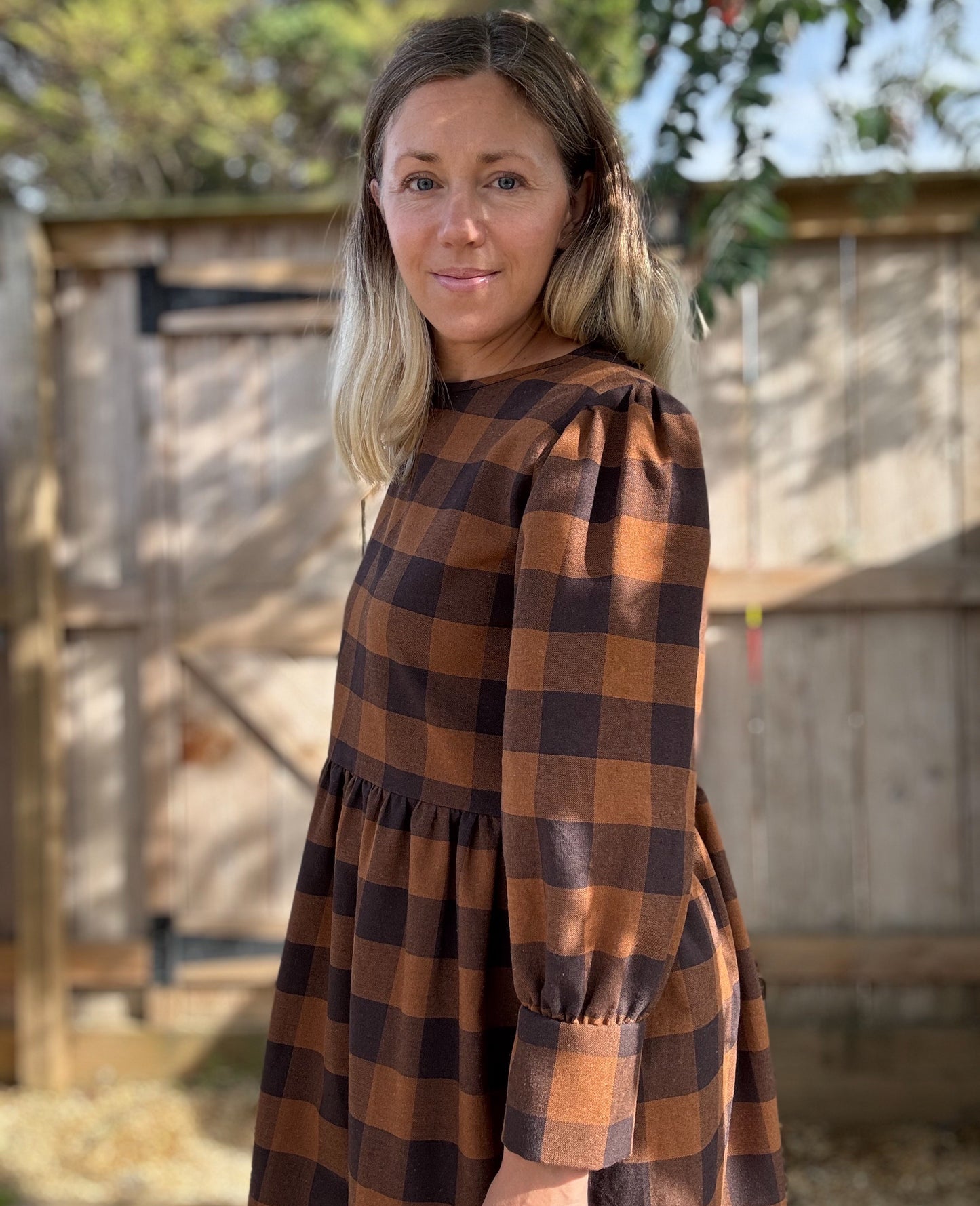The Fern Dress in navy and chestnut check. Cuff detailed midi dress.