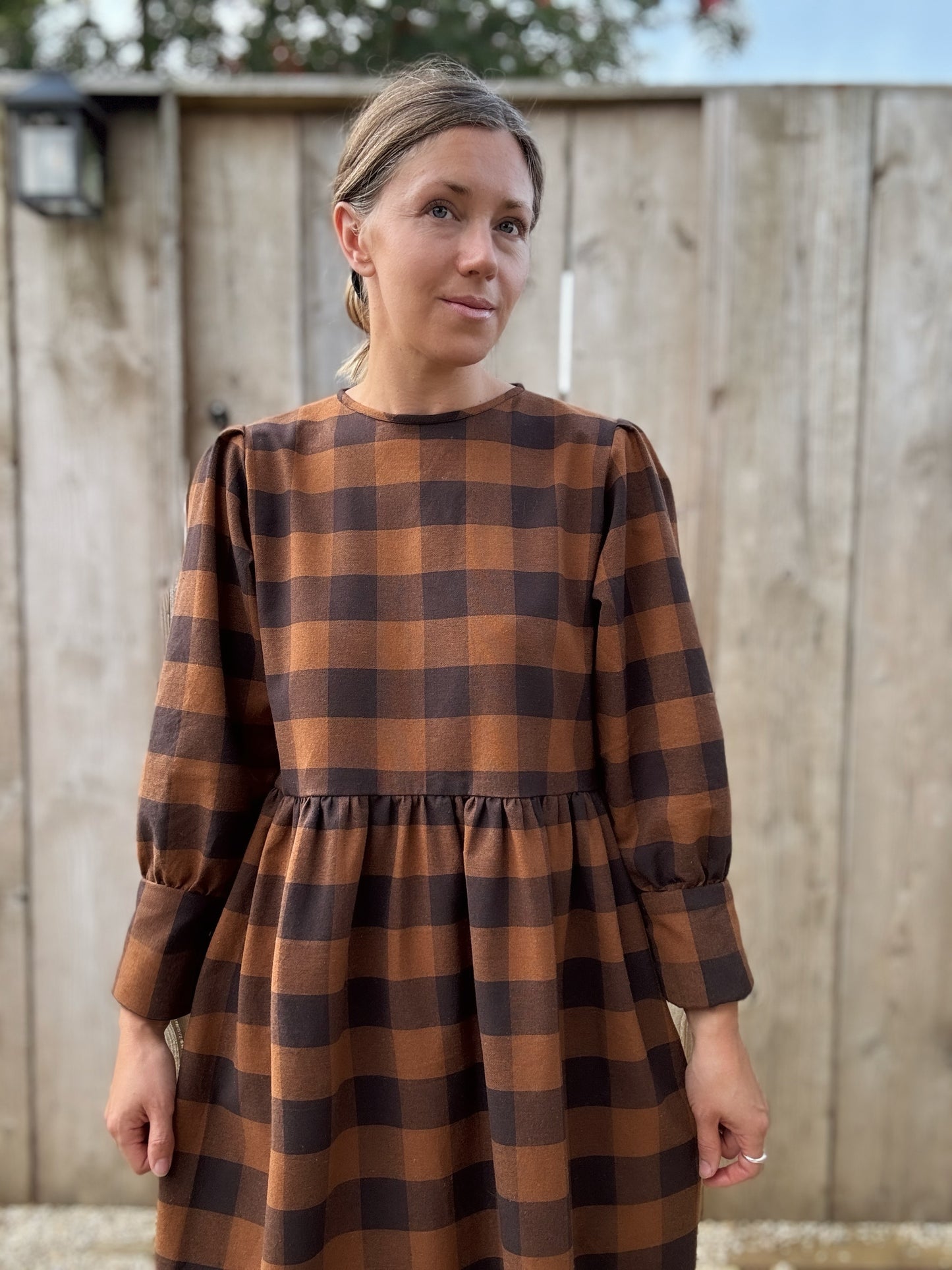 The Fern Dress in navy and chestnut check. Cuff detailed midi dress.